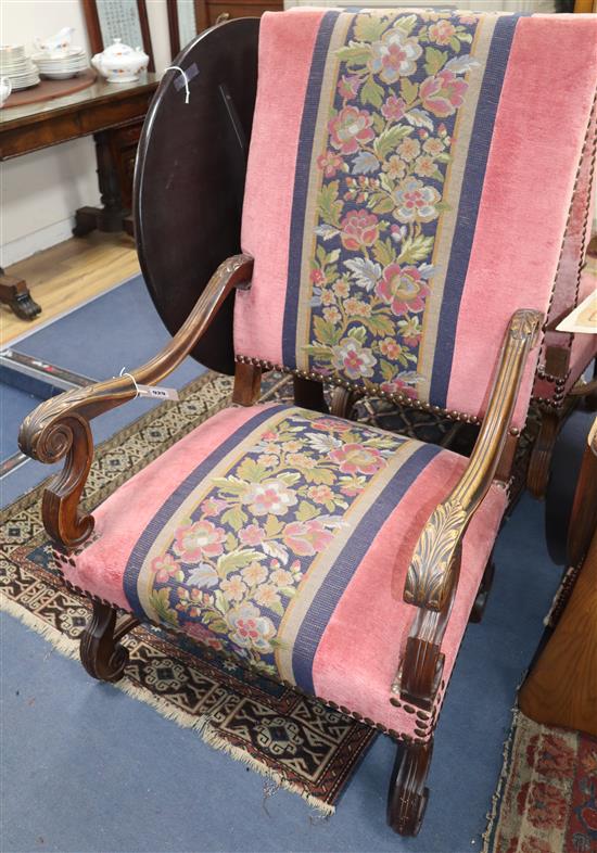 A pair of Louis XVI style walnut elbow chairs